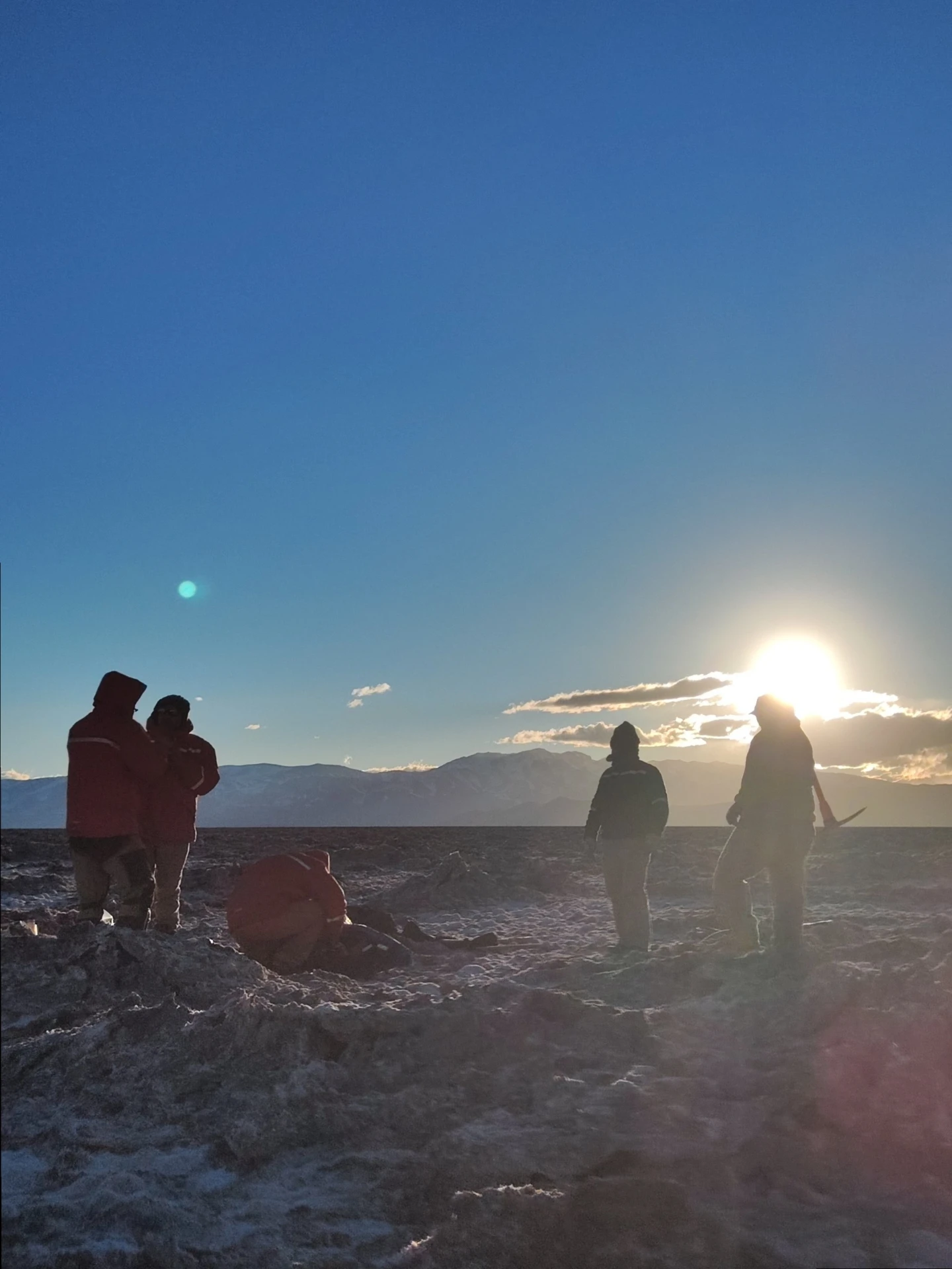 Field crew working on the salar at sunrise