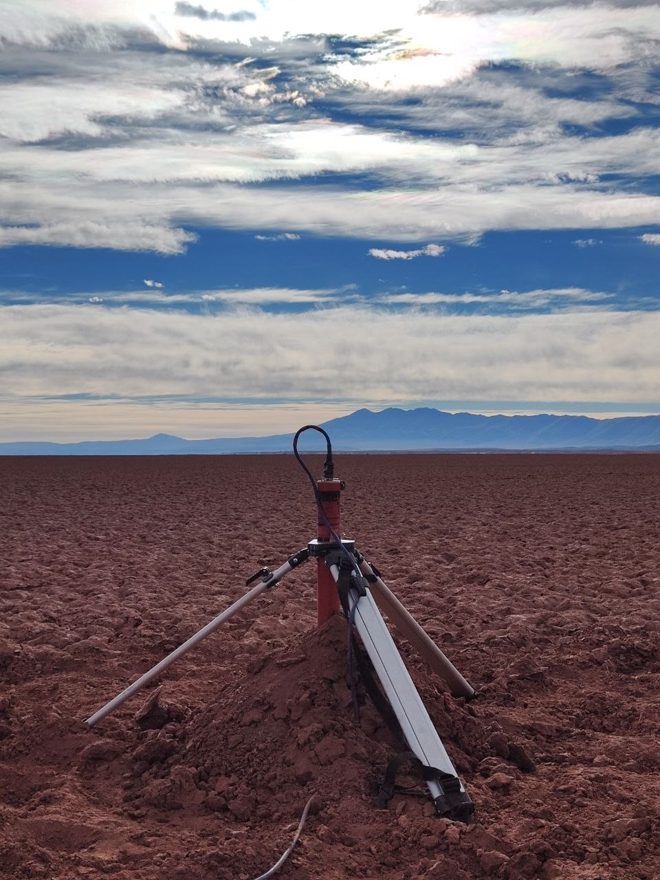 Magnetotelluric sensor installed on a tripod on the salar
