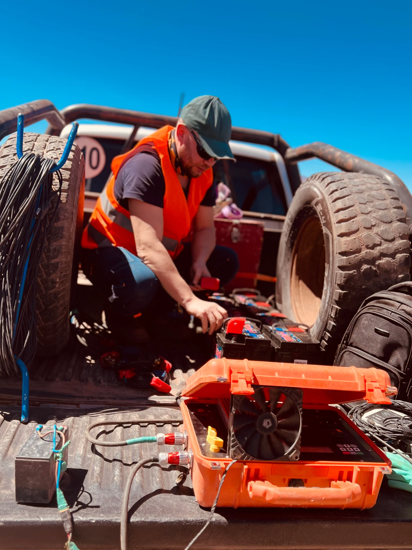 TEM acquisition — operator preparing the transmitter and batteries in the field
